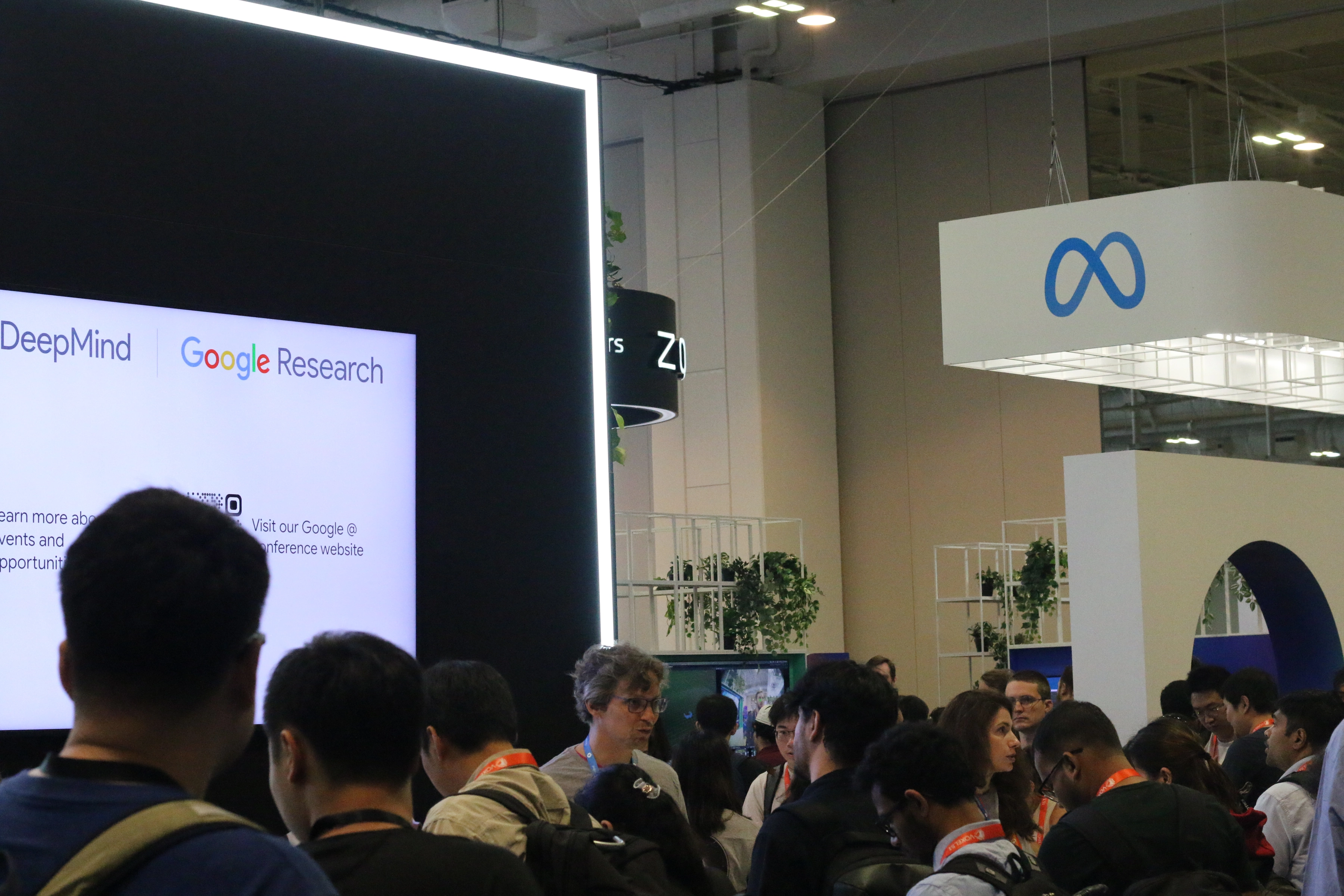 Attendees visiting industry exhibits at CVPR 2025