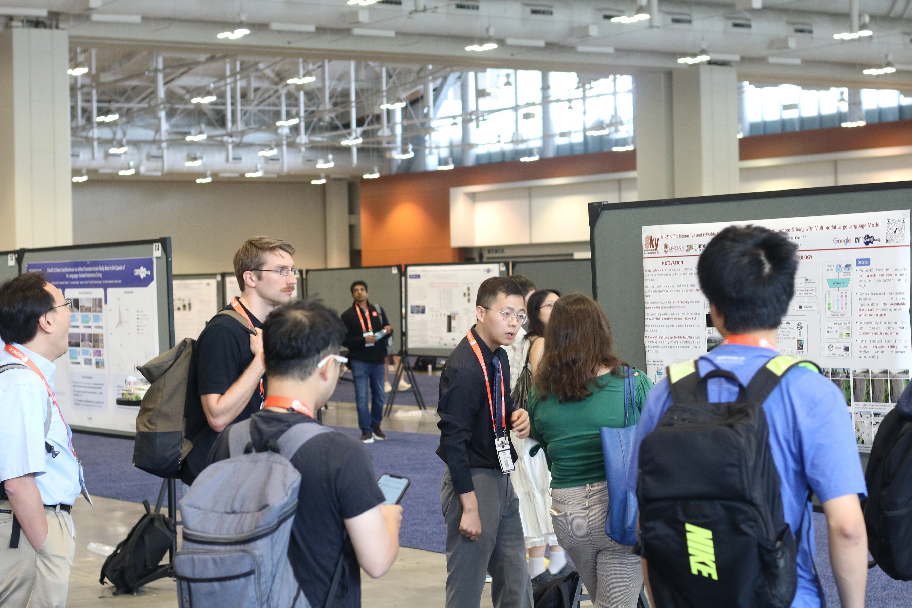 Presenting the Talk2Traffic research poster to attendees at CVPR 2025