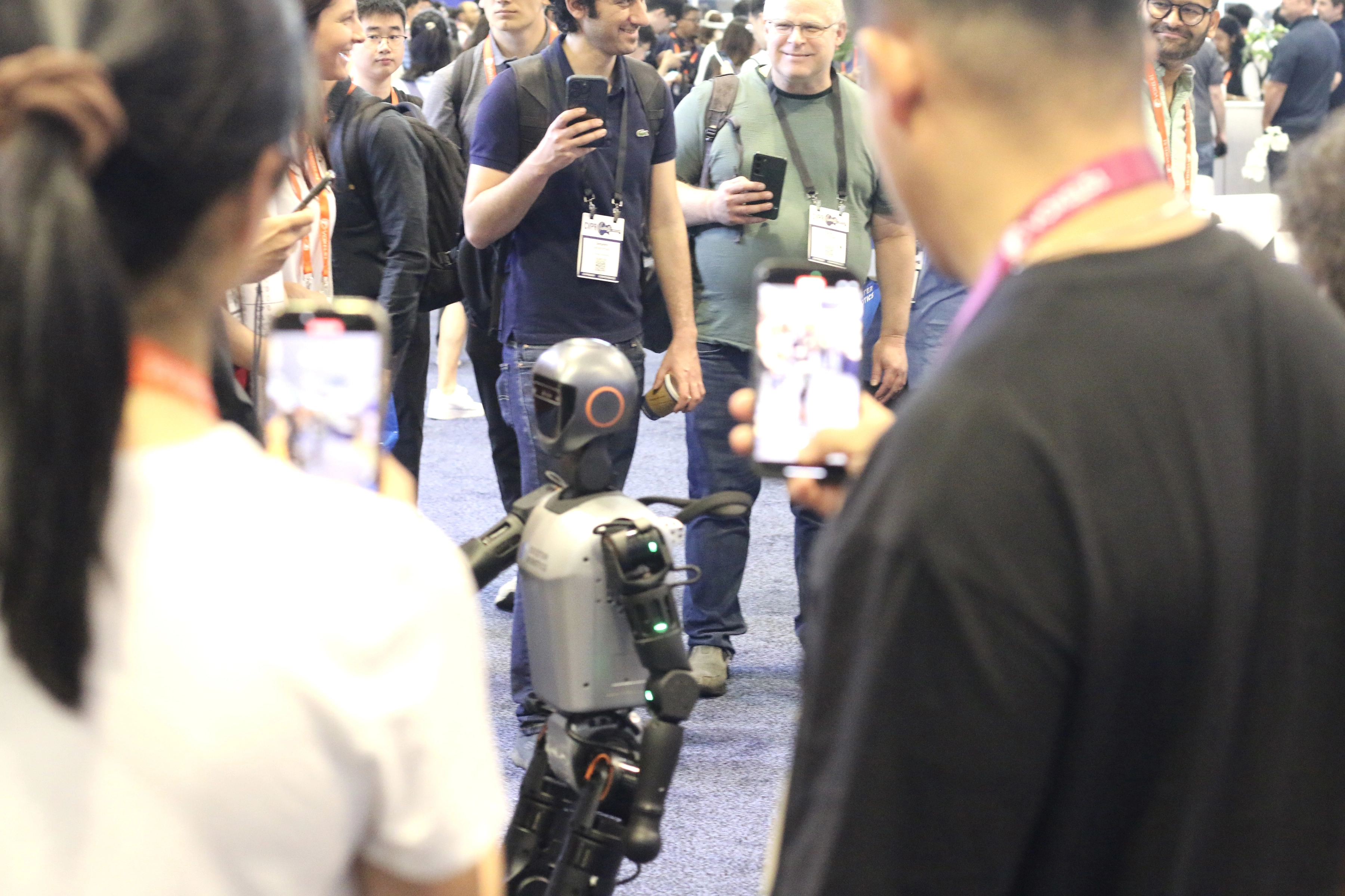 Attendees watching a robotics demonstration at CVPR 2025
