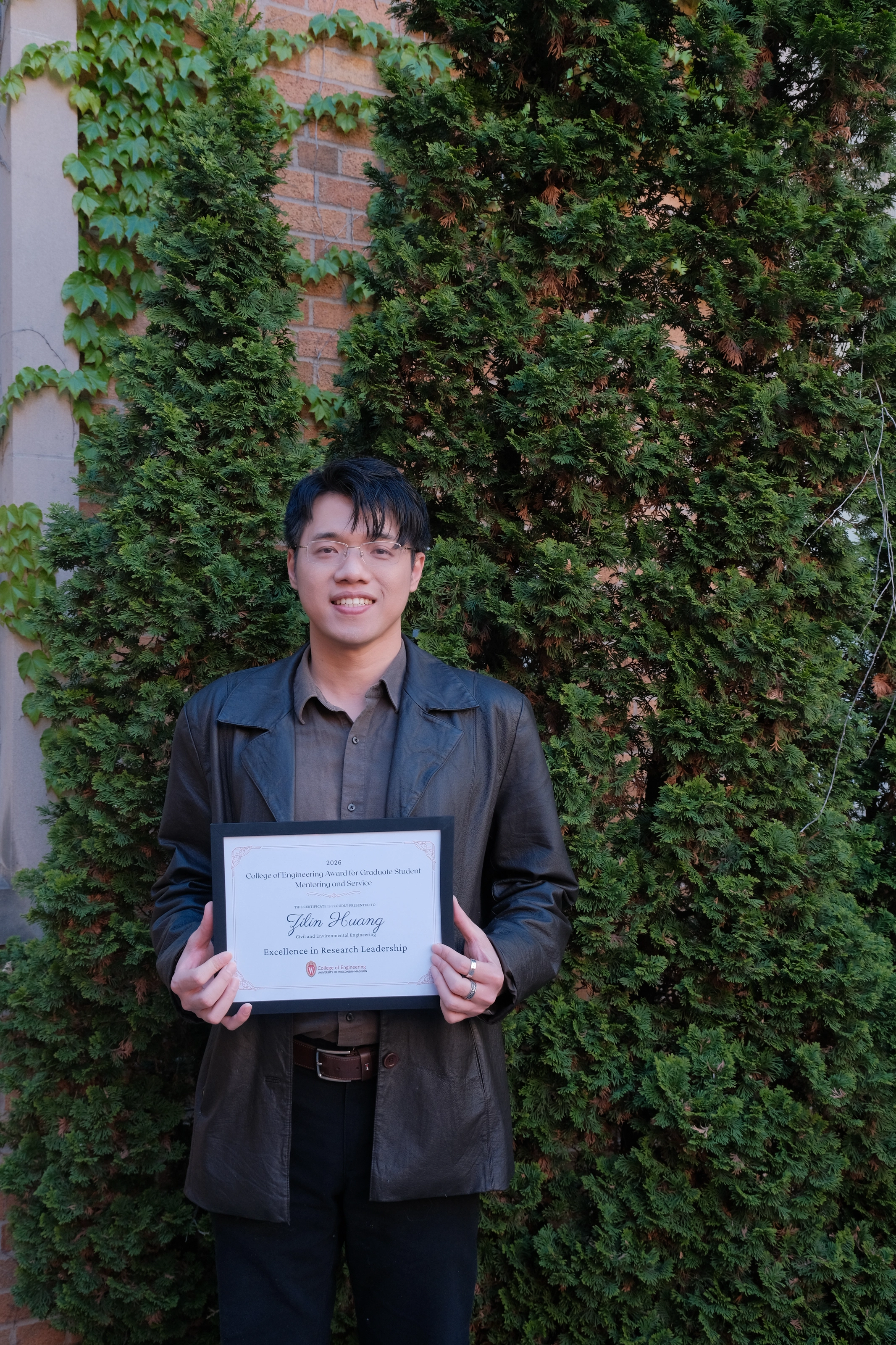 Zilin Huang holding the College of Engineering Graduate Student Mentoring Award
