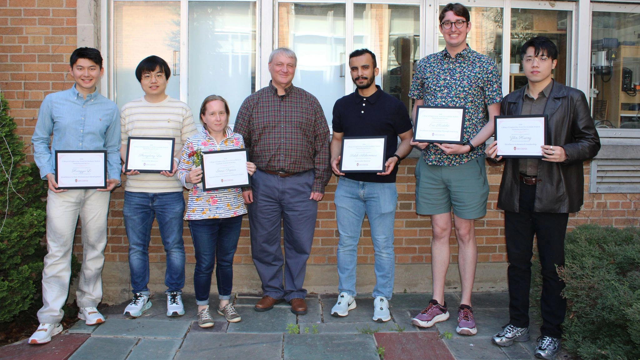 Graduate student mentoring award recipients from Civil and Environmental Engineering with department leadership