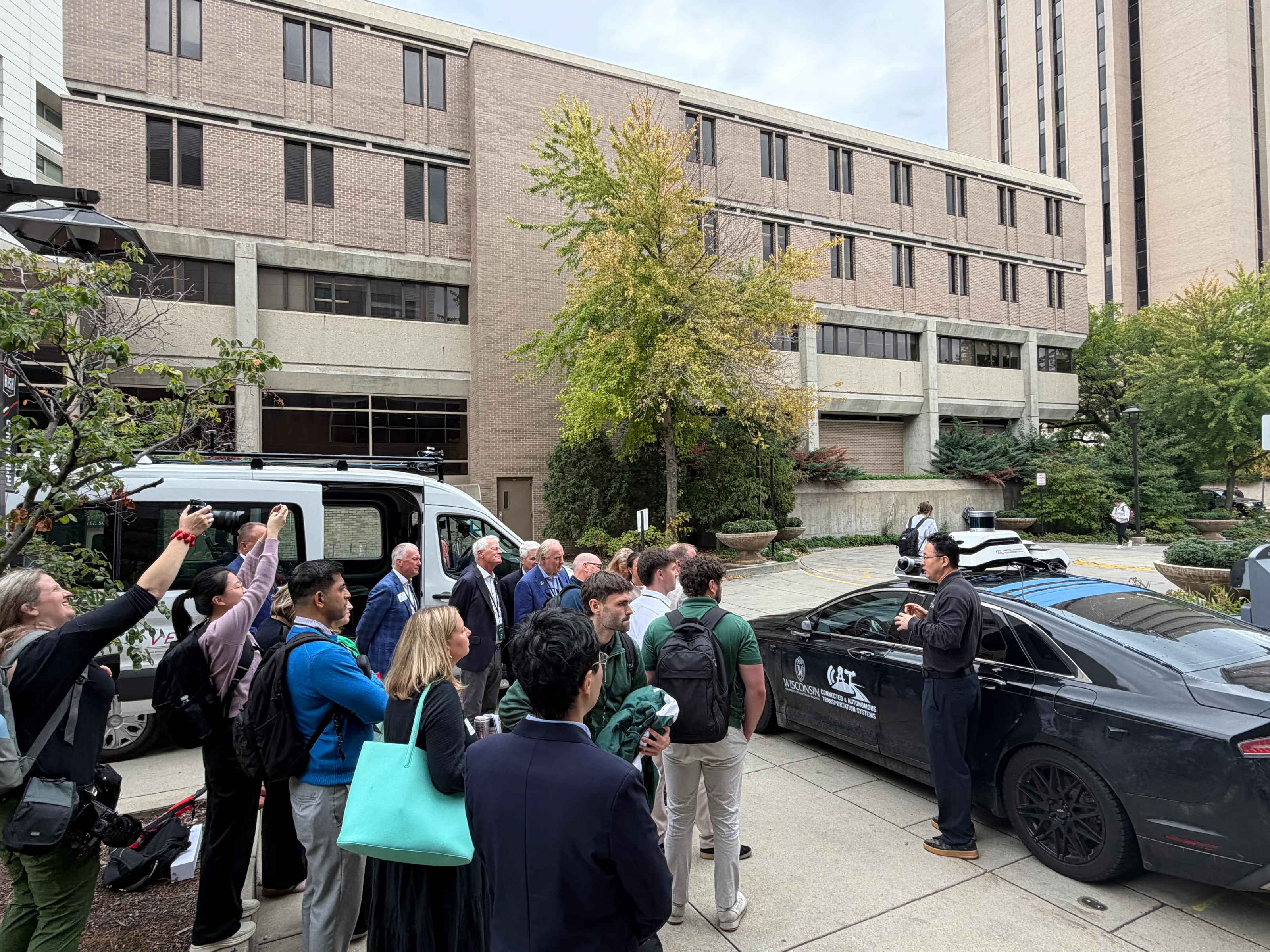 Irish delegation members learning about a connected and autonomous research vehicle