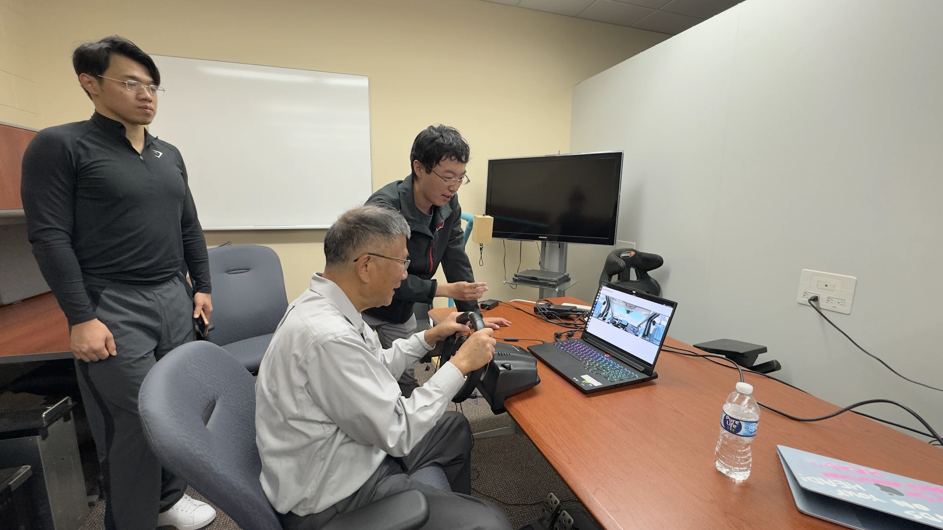 Jong-Shi Pang operating the remote-driving control station during his visit to UW–Madison