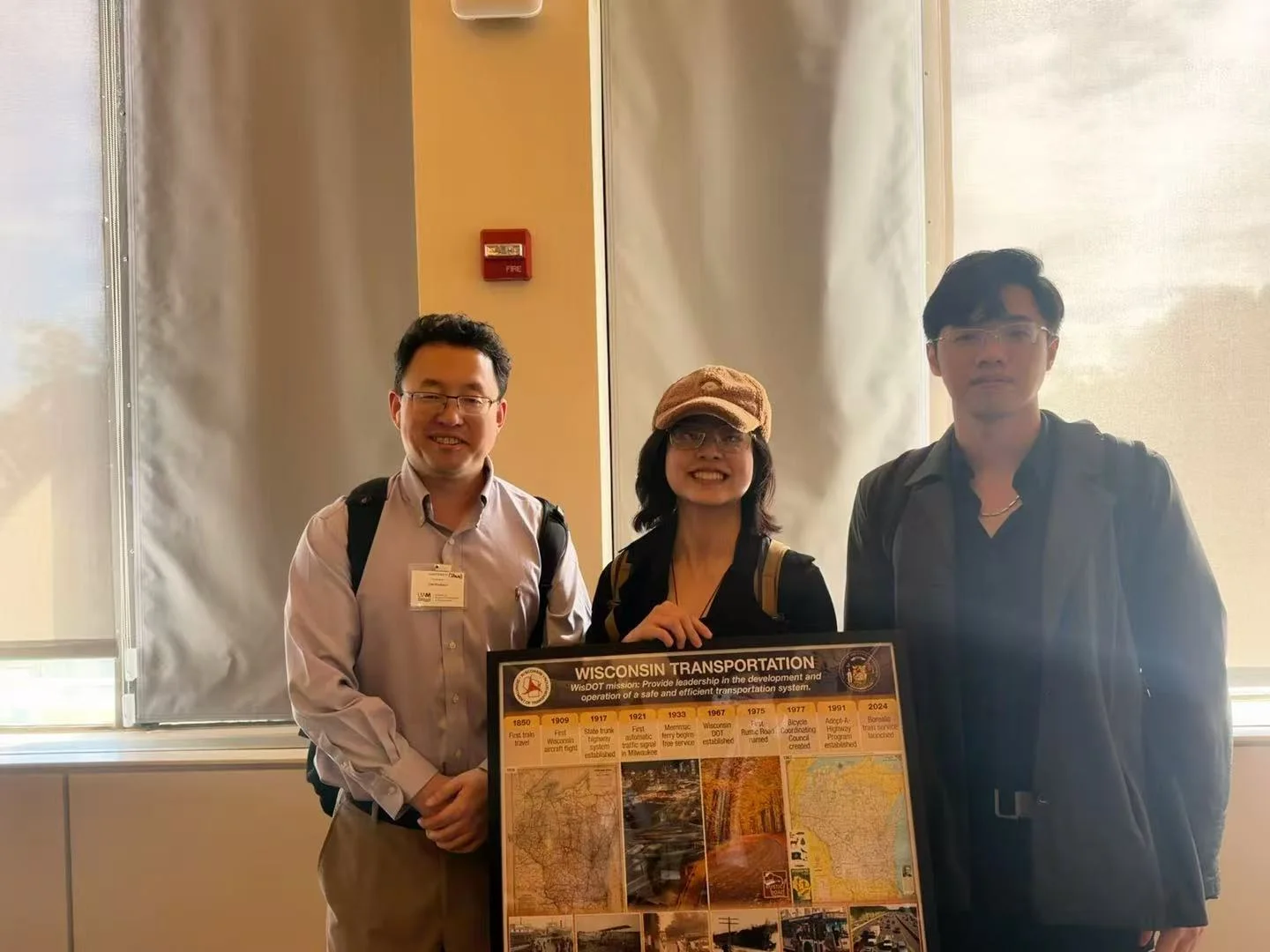 Zilin Huang with Professor Xiaopeng Li and Sky-Lab member Ruolin Yang at the 2026 Southeast Wisconsin Transportation Symposium