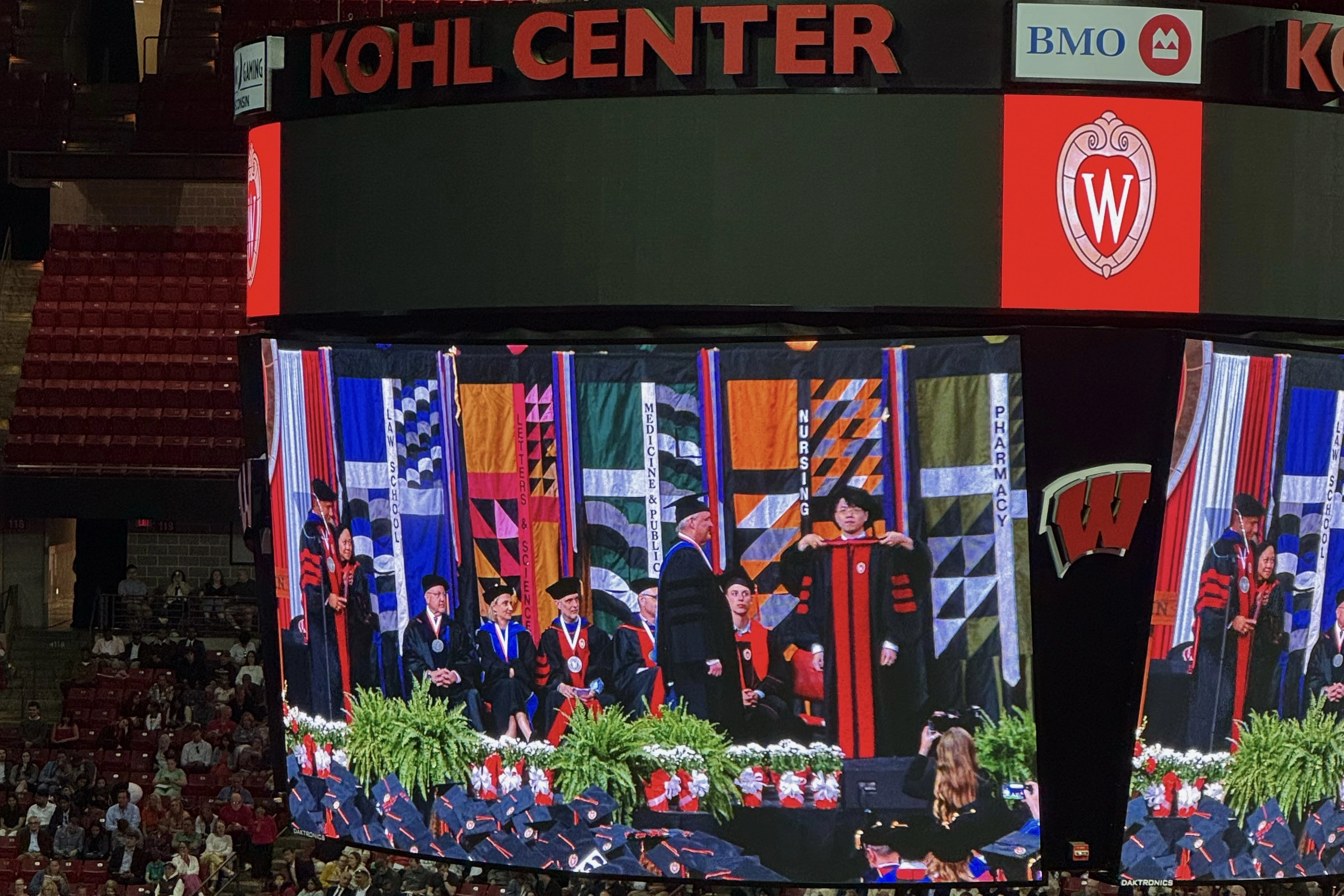 Zilin Huang on the Kohl Center video board during commencement