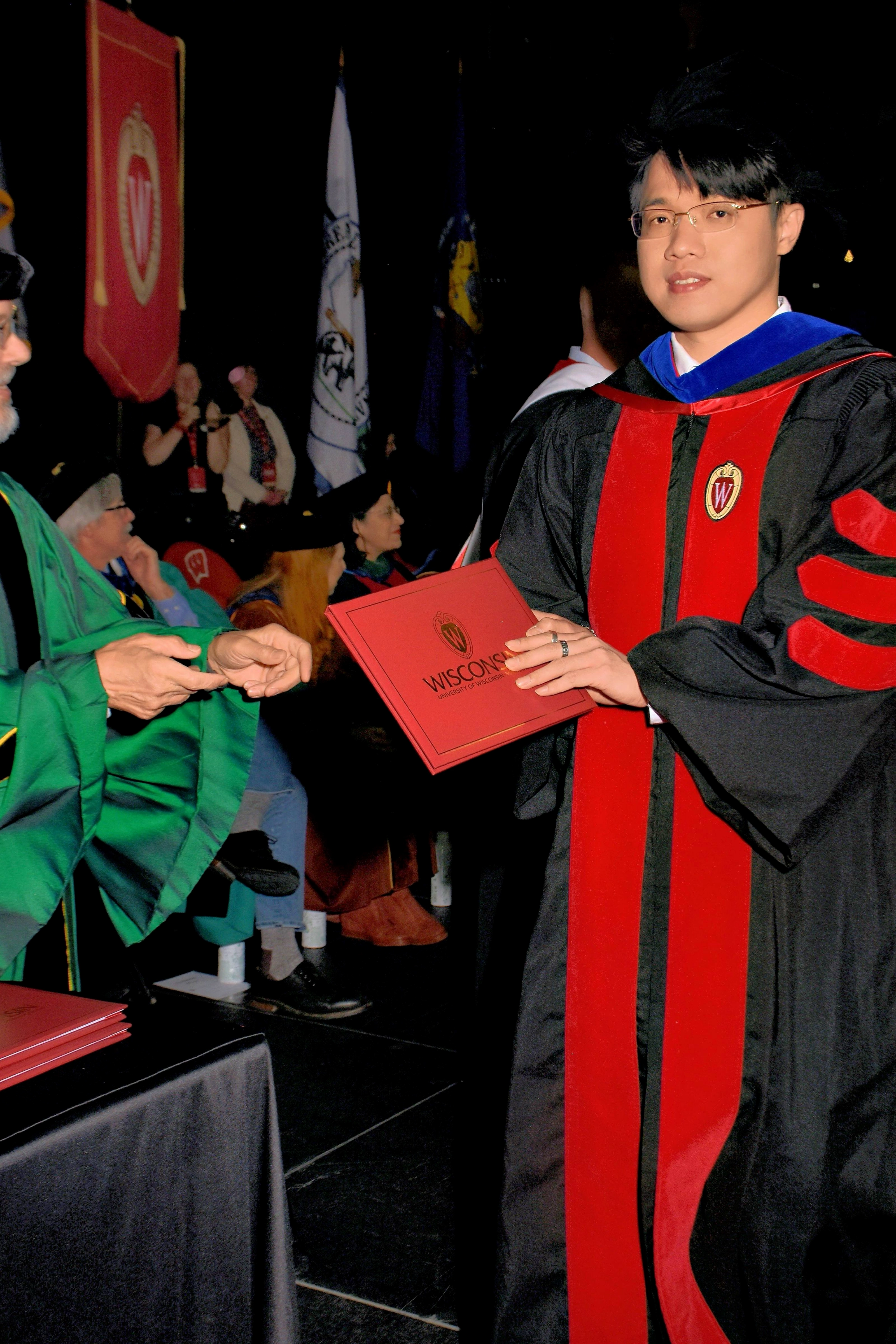 Zilin Huang receiving his doctoral diploma