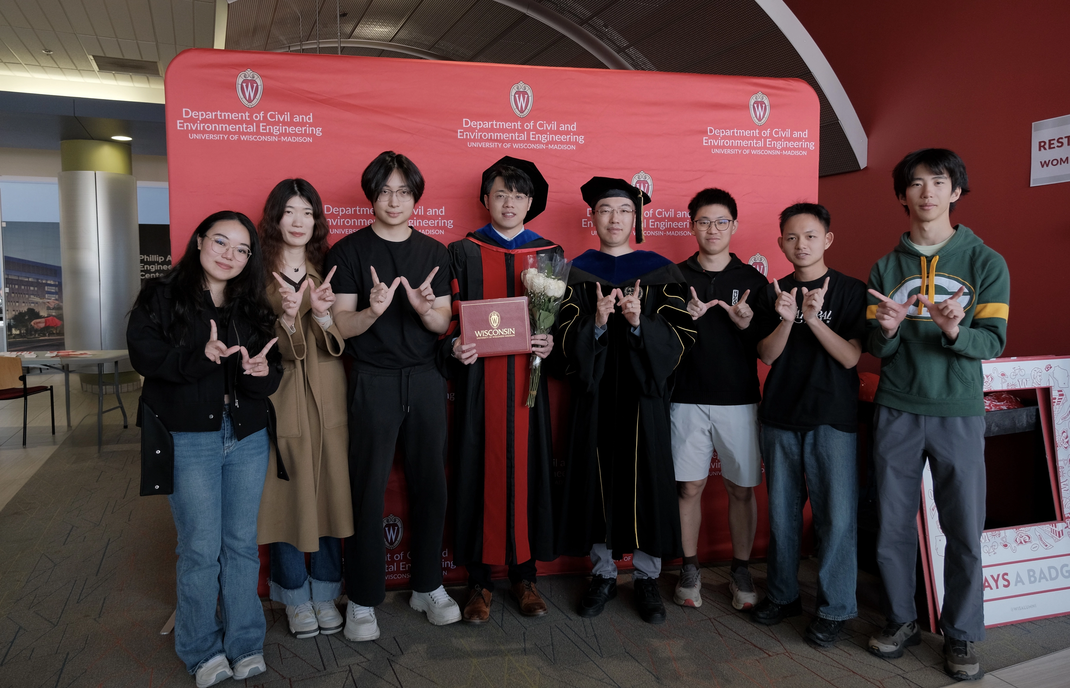 Zilin Huang celebrating commencement with Sky-Lab members and friends
