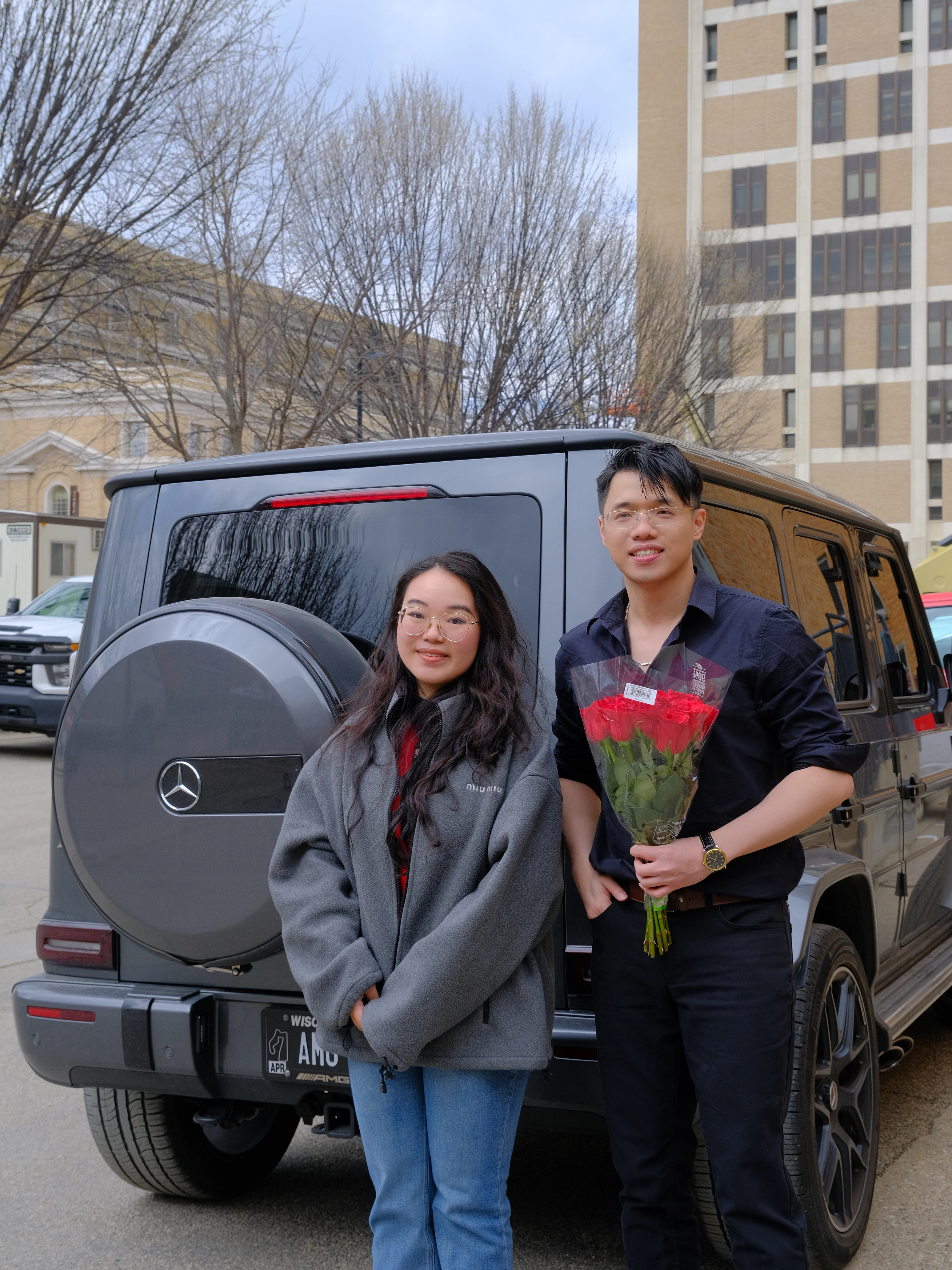 Zilin Huang celebrating his Ph.D. defense with a friend