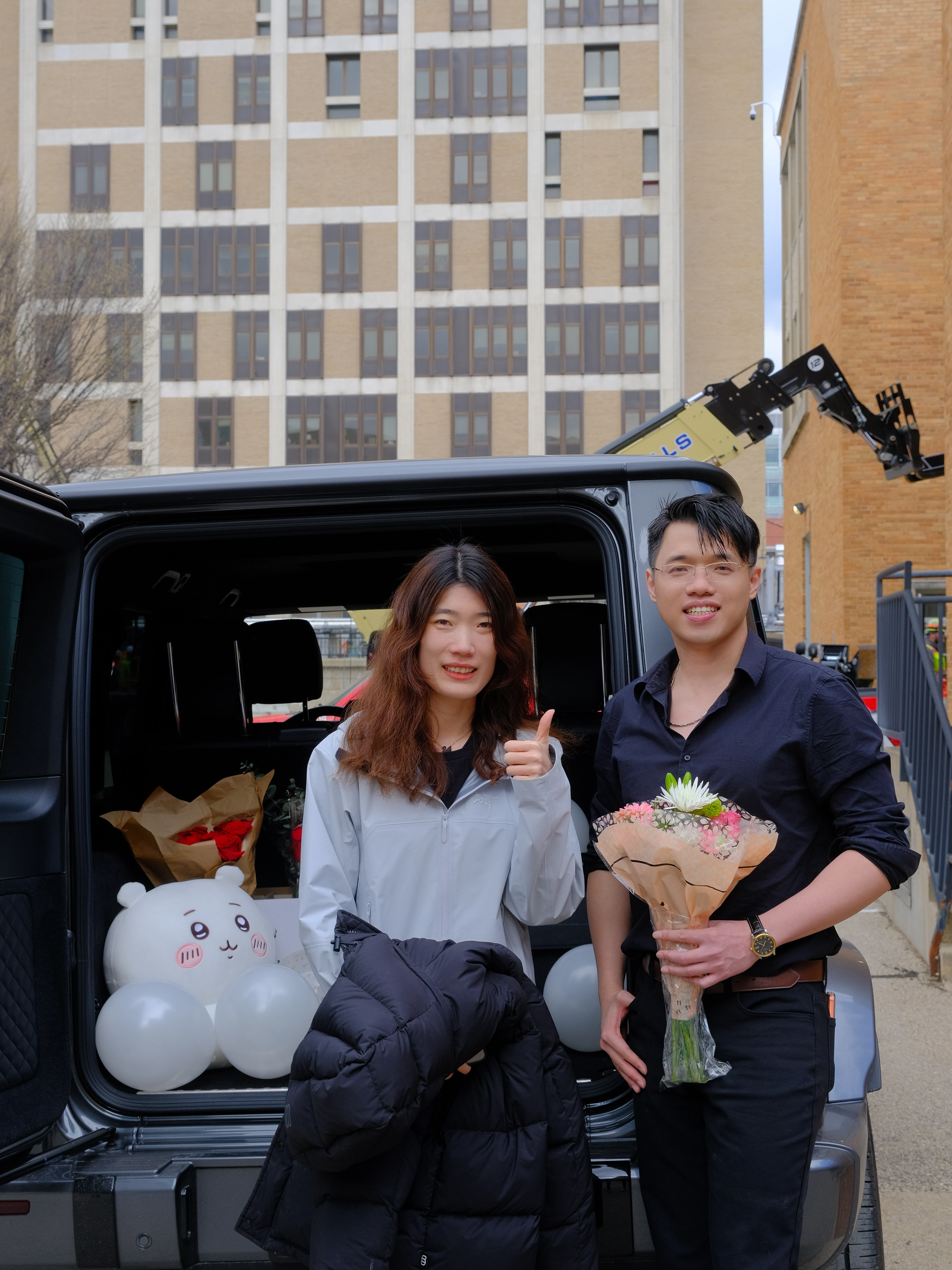 Zilin Huang celebrating his Ph.D. defense with a friend