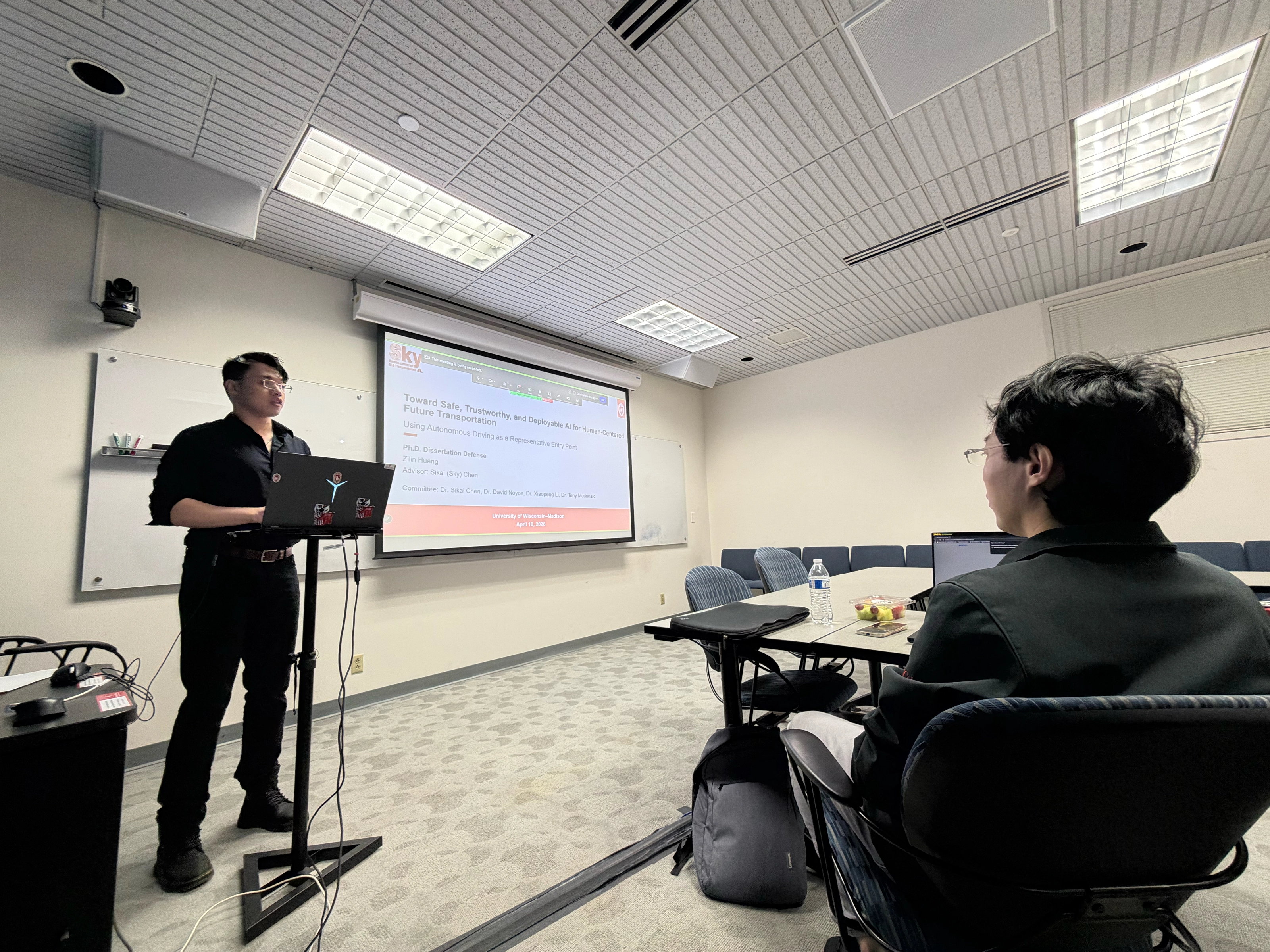 Zilin Huang answering questions during his Ph.D. dissertation defense