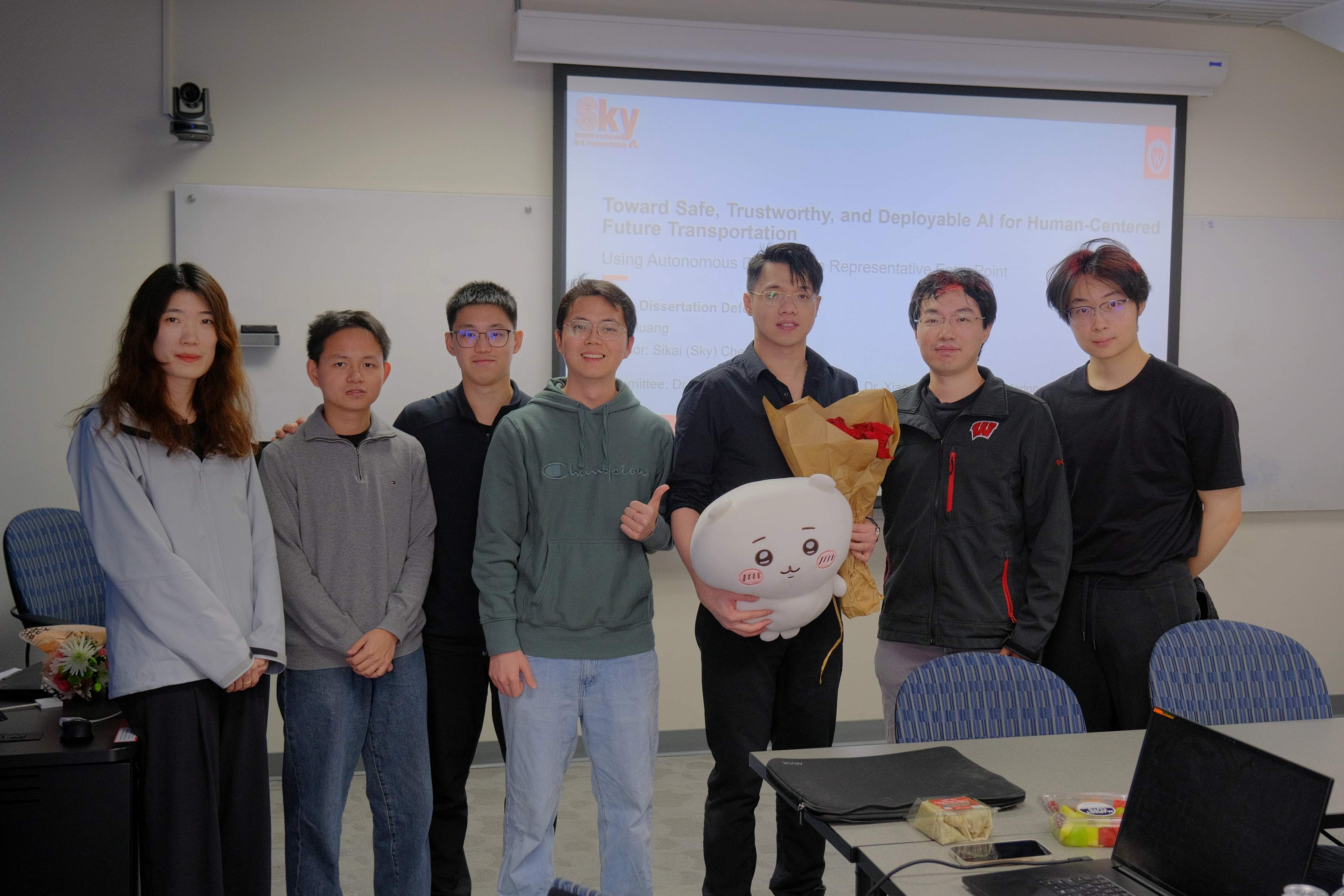 Zilin Huang celebrating his Ph.D. defense with Sky-Lab members
