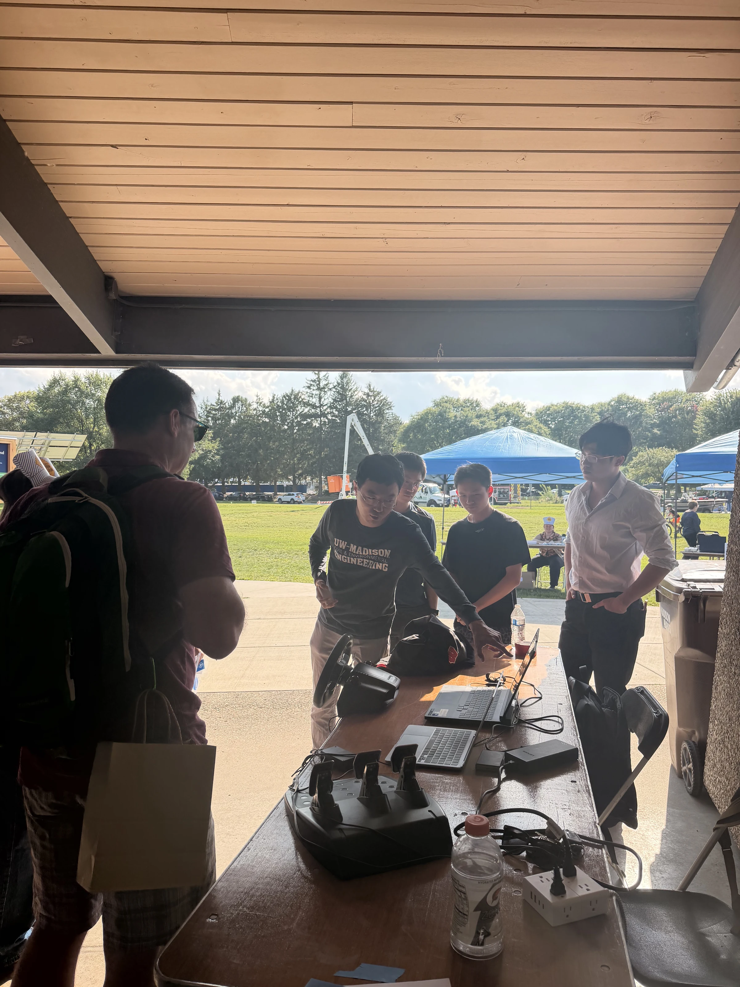 Community visitors learning about the remote-driving controls