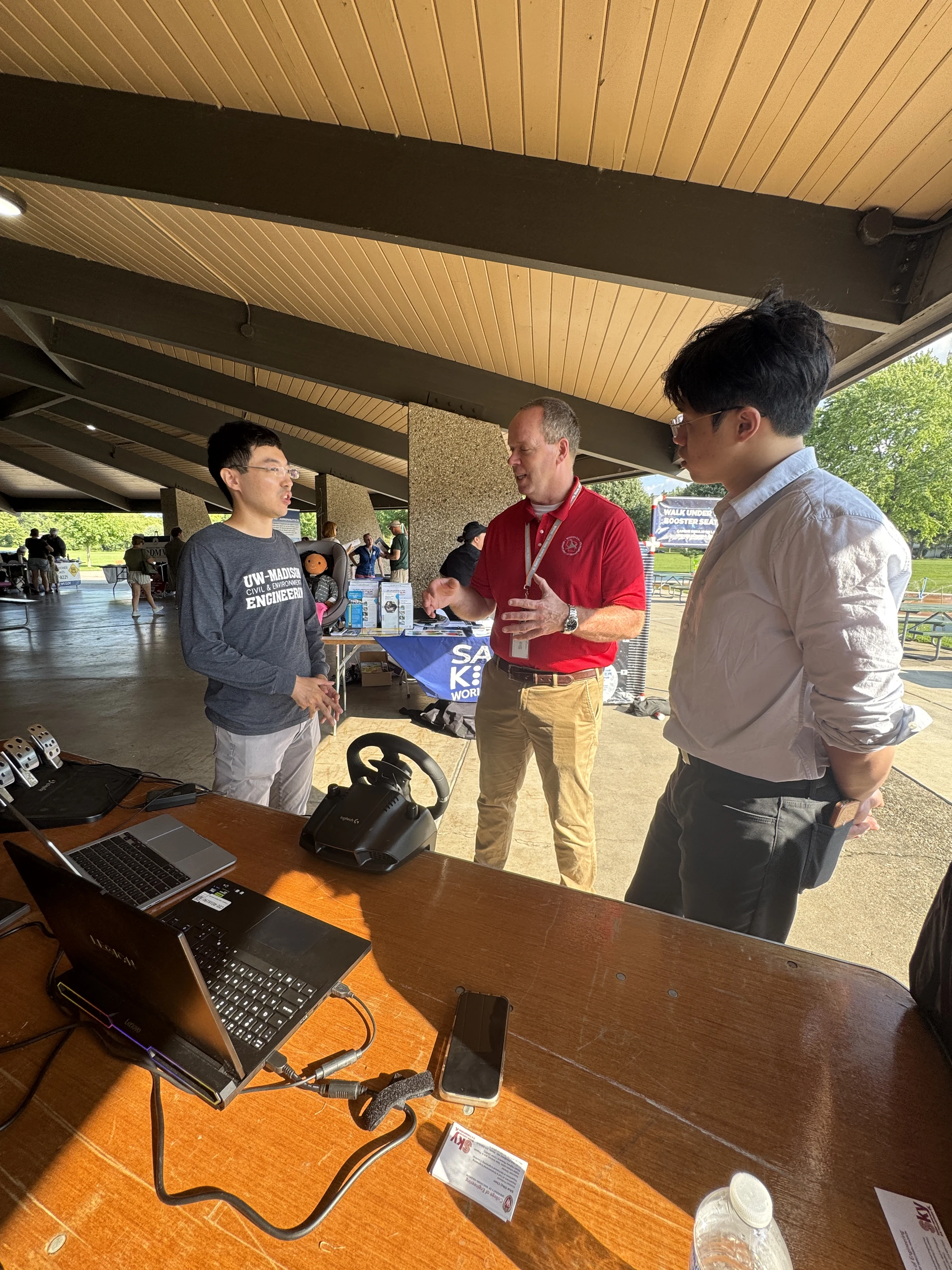 A conversation beside the remote-driving demonstration station