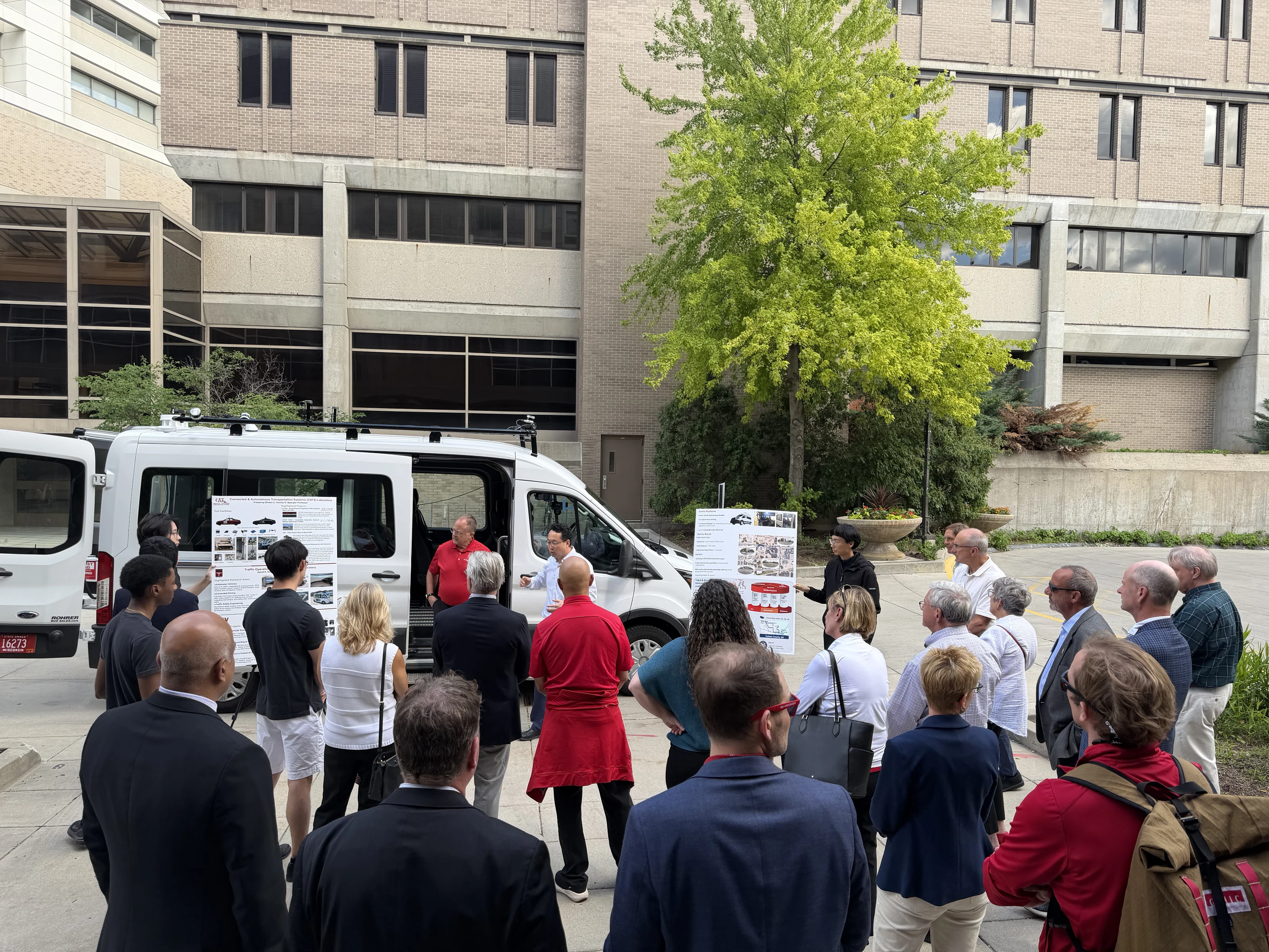 WFAA Board and Alumni Council members attending the autonomous vehicle demonstration